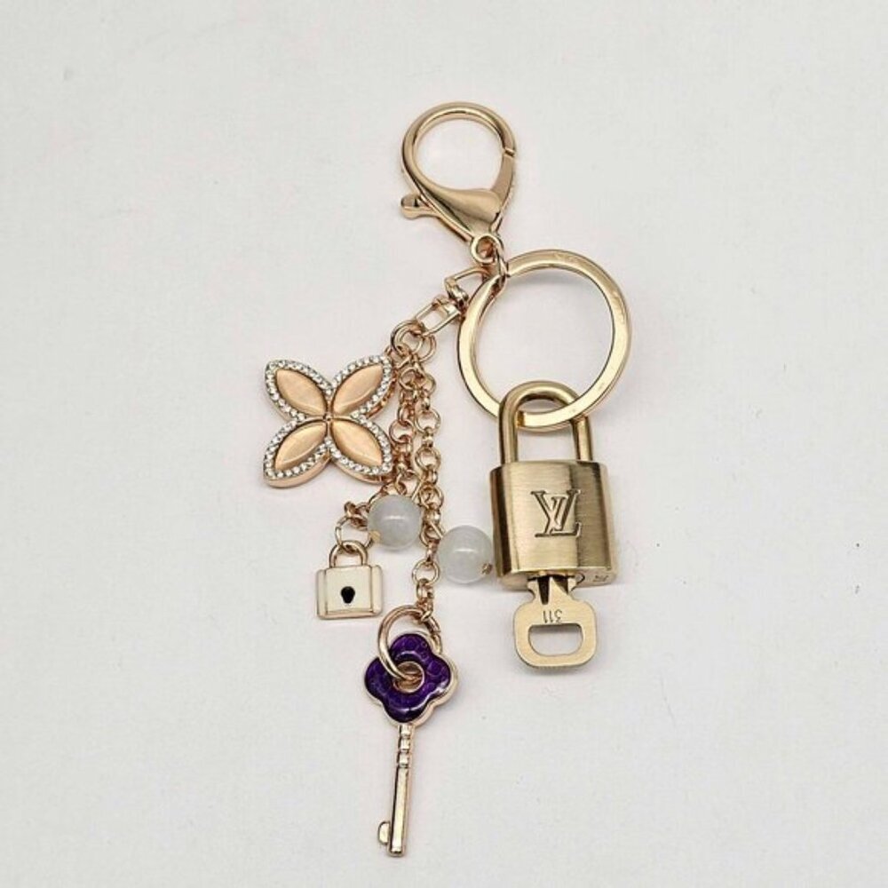 Authentic Louis Vuitton Lock & Key with unbranded Clover Flower Bagcharm 111225